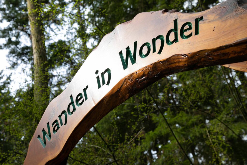 A sign welcomes people to Price Sculpture Forest on Wednesday, April 5, 2023, in Coupeville, Washington. (Ryan Berry / The Herald)
