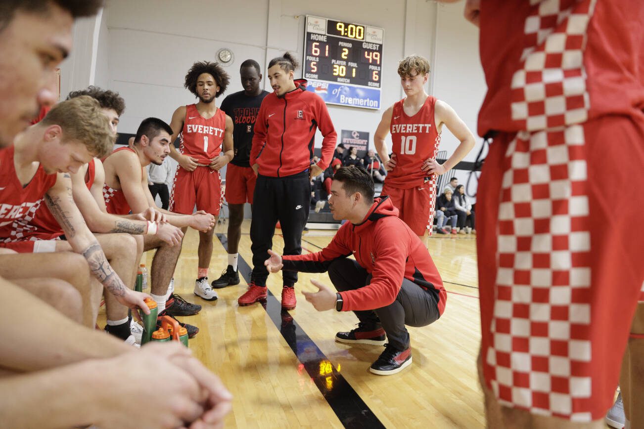 Everett Community College has hired longtime assistant coach Daniel Thompson (middle) as its new head men's basketball coach. (EvCC Athletics photo)