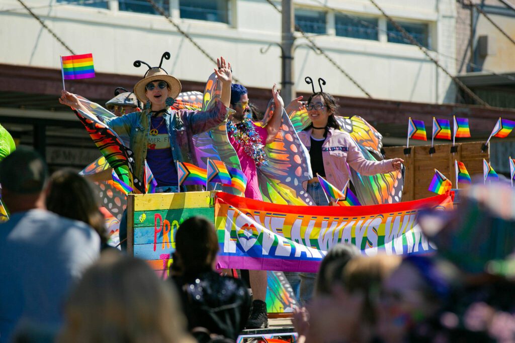 hunA float full of people dressed as butterflies crawls past hundreds celebrating on First Street during Snohomish’s inaugural Pride celebration on Saturday, June 3, 2023, in downtown Snohomish, Washington. (Ryan Berry / The Herald)
