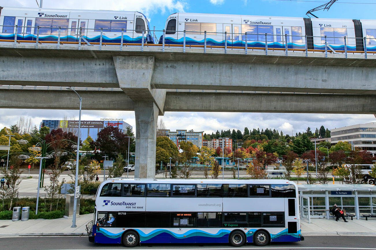 A Sound Transit bus at it's new stop in the shadow of the newly opened Northgate Lightrail Station in Seattle. (Kevin Clark / The Herald)