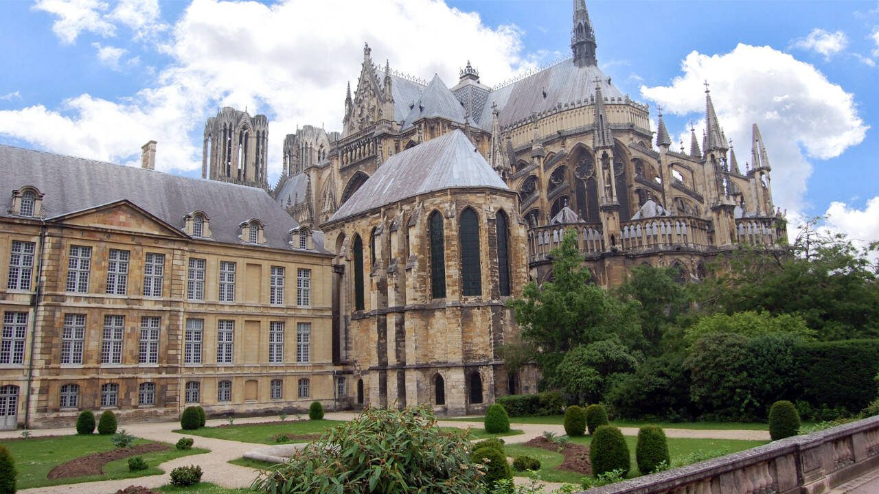 A glorious example of Gothic architecture, Reims Cathedral’s construction began in 1211. Around the back of the church, flying buttresses are hard at work, supporting the massive structure. (Rick Steves’ Europe)