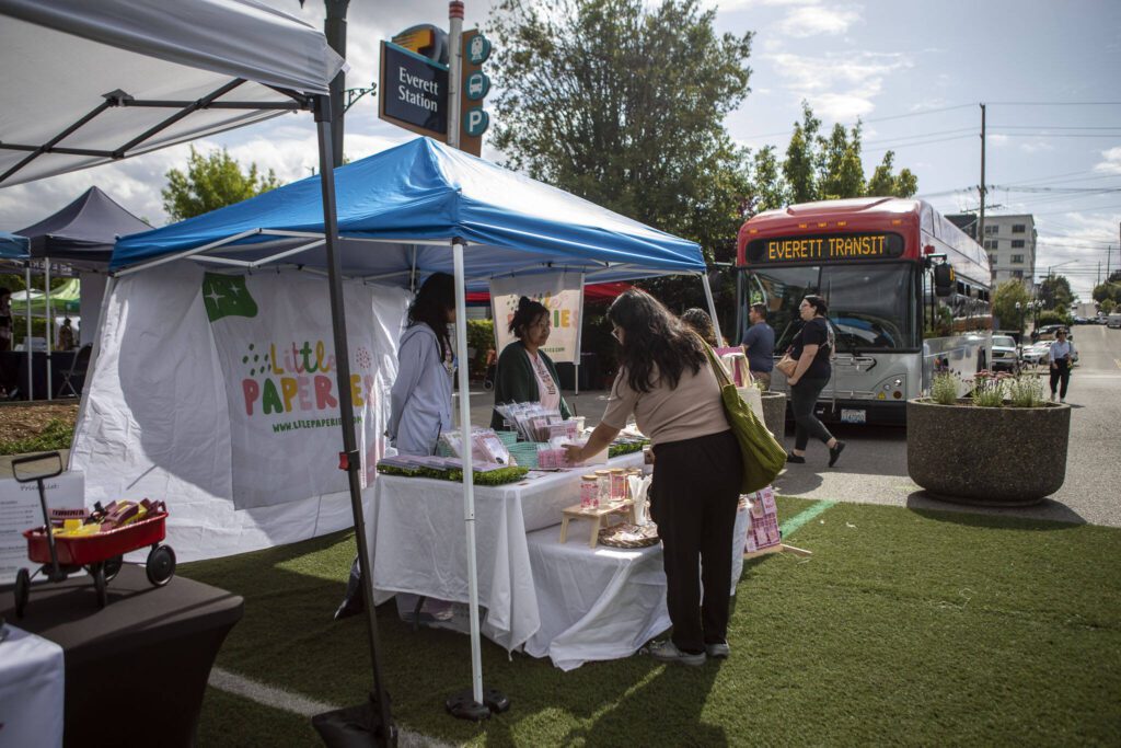 The Little Paperies booth at the Everett Farmers Market across from the Everett Station in Everett, Washington on Wednesday, June 14, 2023. (Annie Barker / The Herald)
