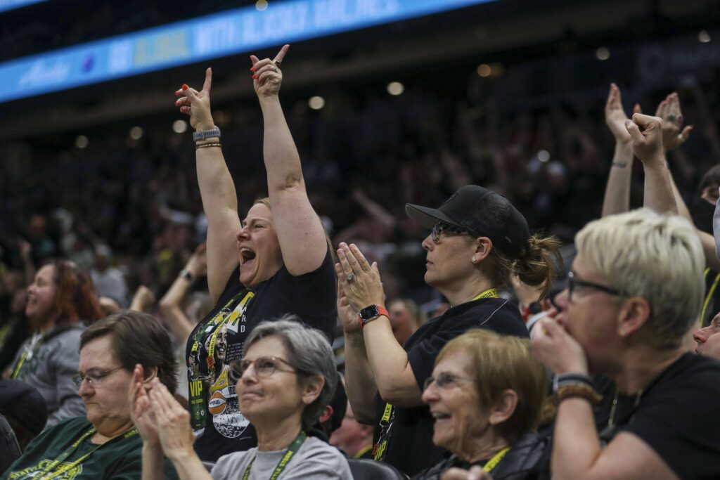 Fans cheer during a WNBA basketball game in Seattle, Washington on Sunday, June 11, 2023. The Storm fell, 71-65. (Annie Barker / The Herald)
