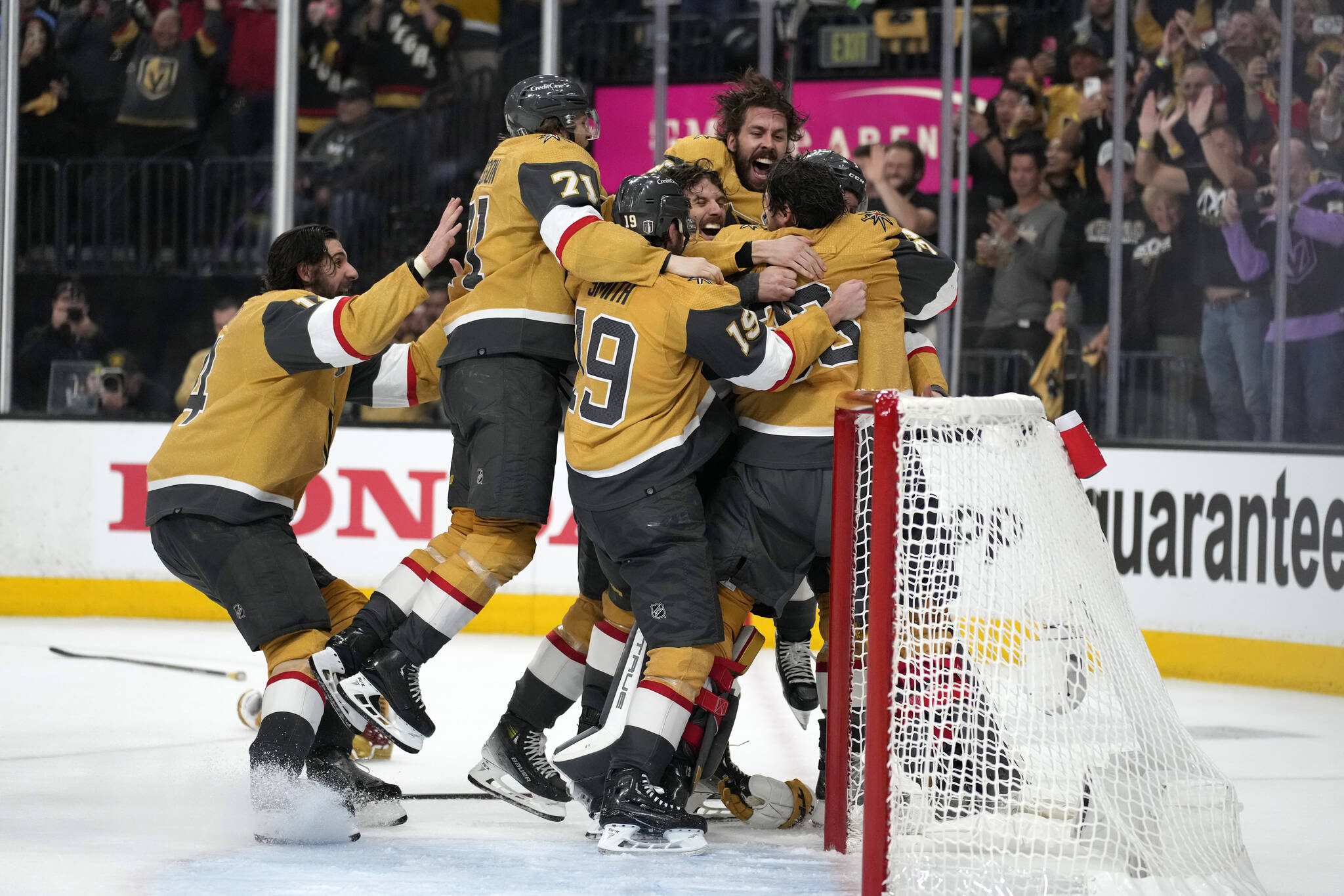 Members of the Vegas Golden Knights celebrate after they defeated the Florida Panthers 9-3 in Game 5 to win the Stanley Cup on Tuesday in Las Vegas. (AP Photo/John Locher)