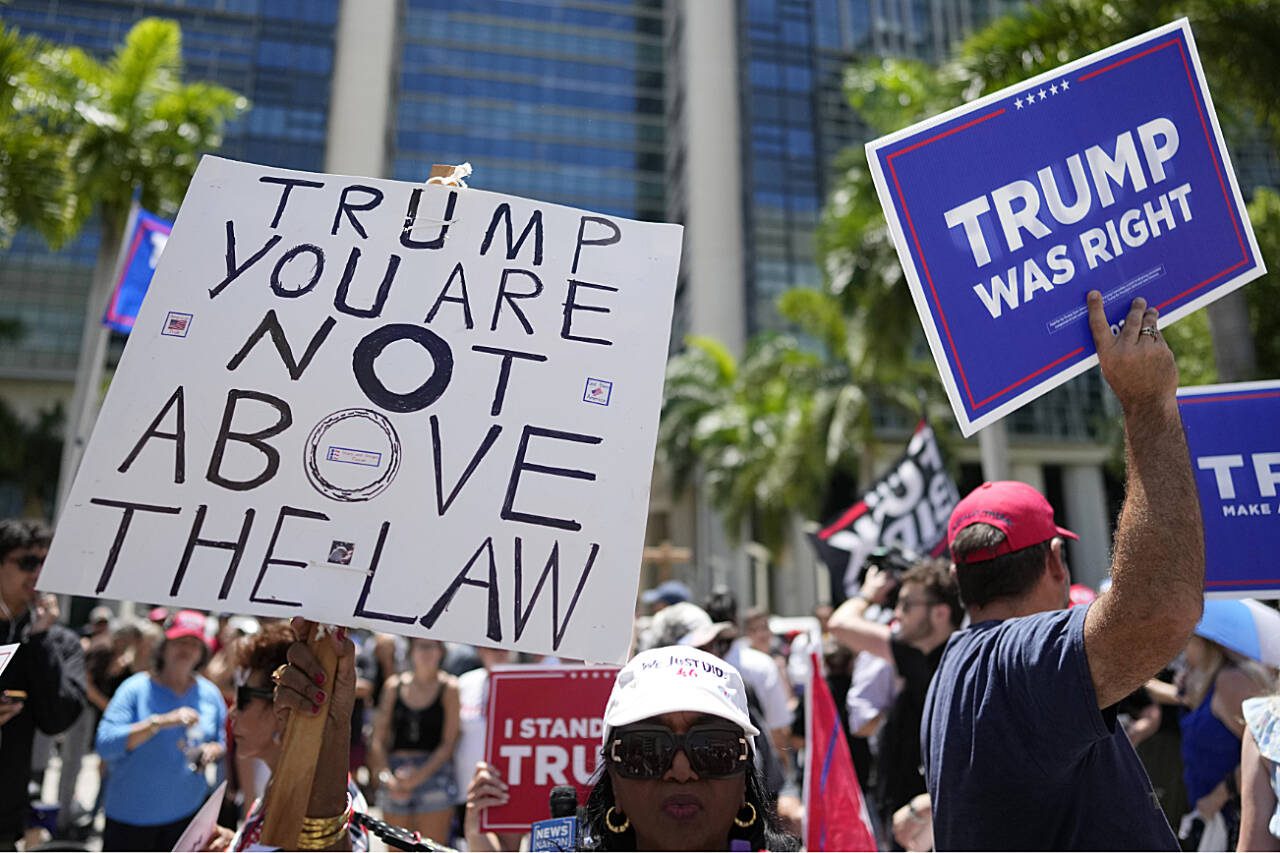 People rally outside the Wilkie D. Ferguson Jr. U.S. Courthouse, Tuesday, in Miami. Former President Donald Trump appeared in federal court Tuesday on dozens of felony charges accusing him of illegally hoarding classified documents and thwarting the Justice Department’s efforts to get the records back. (Rebecca Blackwell / Associated Press)