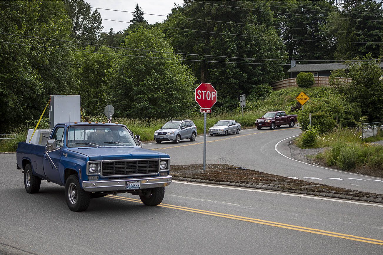 Cars stop and go around the intersections of Lowell Larimer, Marsh and Seattle Hill roads in Snohomish, Washington on Wednesday, June 21, 2023. (Annie Barker / The Herald)