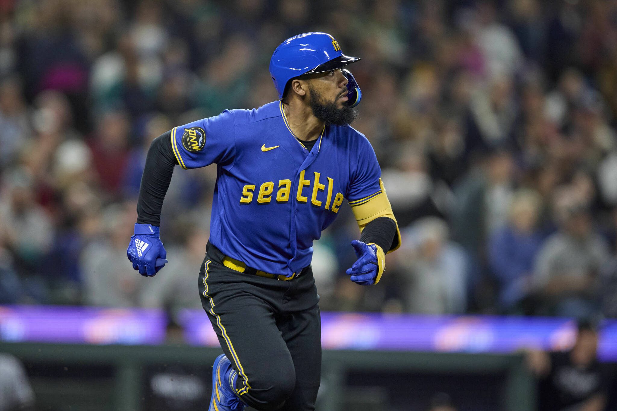 The Mariners’ Teoscar Hernandez watches his solo home run off White Sox relief pitcher Tanner Banks during the seventh inning of a game Friday in Seattle. (AP Photo/John Froschauer)