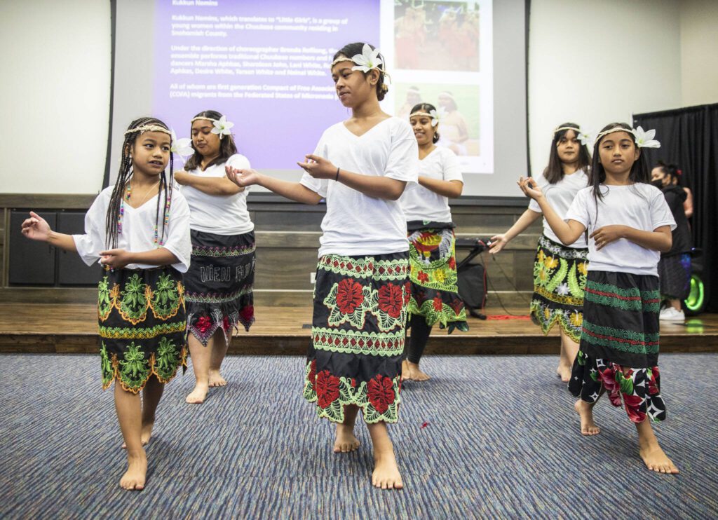 Kukkun Nemins group performs while representing the Federated Staes of Micronesia during World Refugee Day at Everett Community College on on Tuesday, June 20, 2023 in Everett, Washington. (Olivia Vanni / The Herald)
