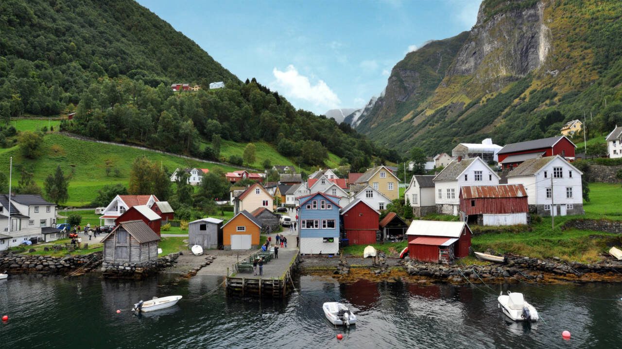 In Norway’s magnificent Sognefjord region, idyllic villages come with a mountainous backdrop. One such village, Undredal, lies along the “Norway in a Nutshell” route sampling the area’s highlights. (Rick Steves’ Europe)