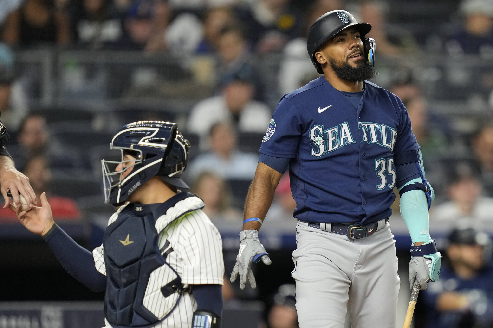 The Mariners’ Teoscar Hernandez (35) reacts to a swinging strike against Yankees relief pitcher Clay Holmes in the ninth inning of a game Tuesday in New York. (AP Photo/John Minchillo)