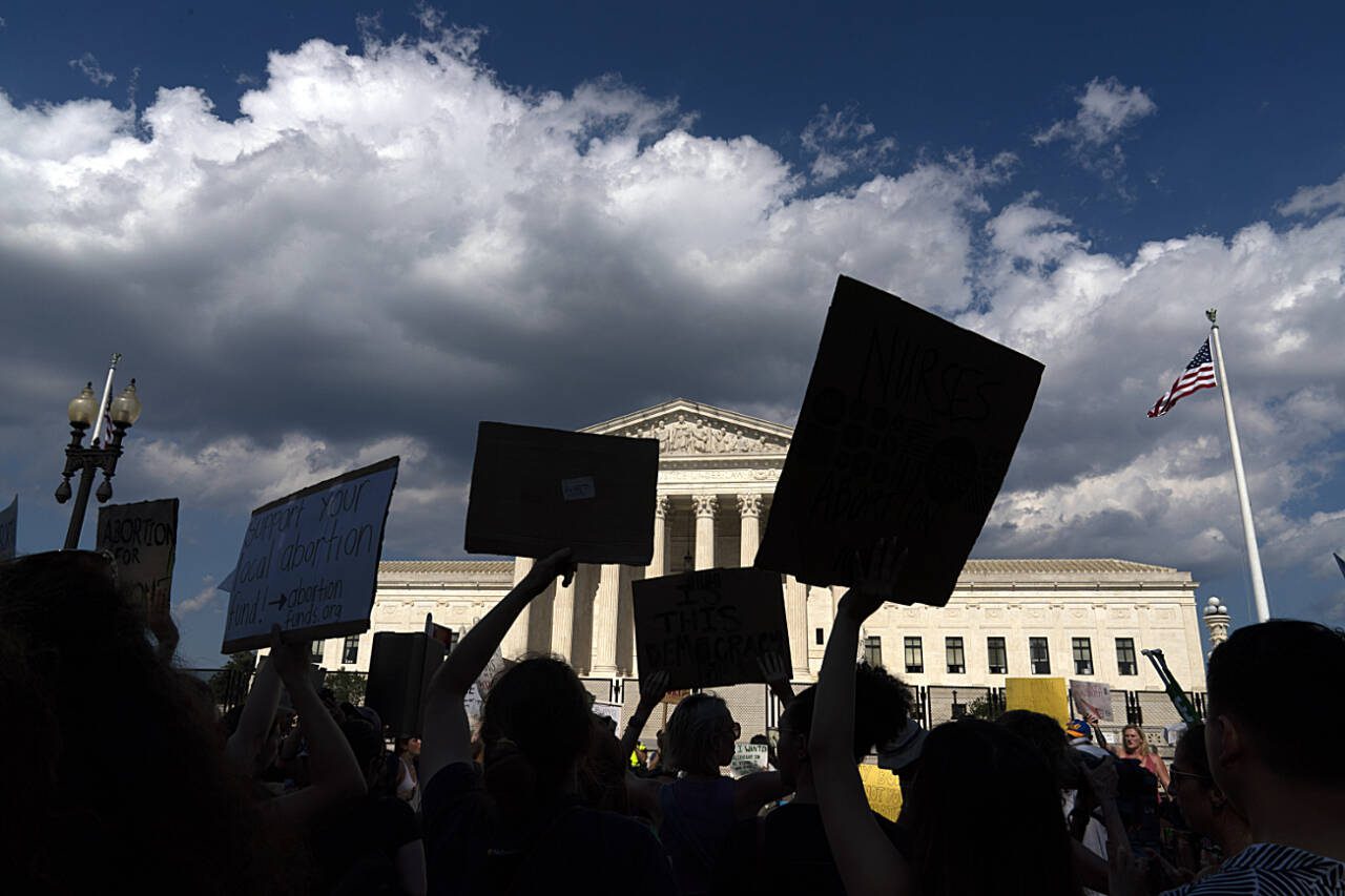 Abortion-rights activists protest outside the U.S. Supreme Court building in Washington, D.C., on June 25, 2022. The Supreme Court’s ruling allowing states to regulate abortion has led to a patchwork of state laws regarding access to abortion services. (Jose Luis Magana / Associated Press file photo)