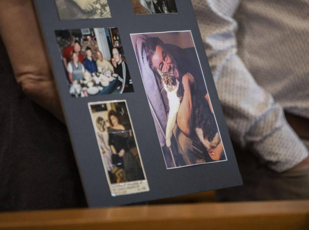 A poster board with pictures of Greg McKnight is held up for display during Baylor&rsquo;s sentencing at the Snohomish County Courthouse on Monday, June 26, 2023 in Everett, Washington. (Olivia Vanni / The Herald)
