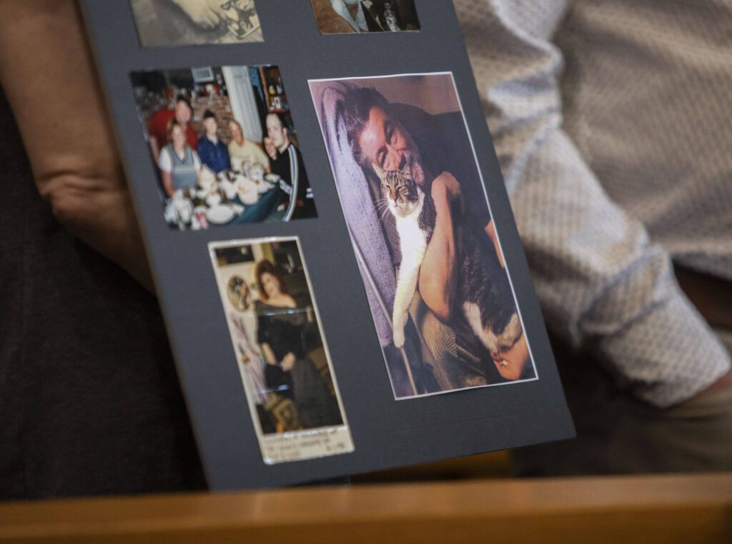 A poster board with pictures of Greg McKnight is held up for display during Baylor’s sentencing at the Snohomish County Courthouse on Monday, June 26, 2023 in Everett, Washington. (Olivia Vanni / The Herald)
