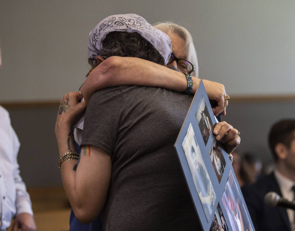 Janelle Danielson and Gail Callahan hug after speaking about Greg McKnight during Baylor&rsquo;s sentencing at the Snohomish County Courthouse on Monday, June 26, 2023 in Everett, Washington. (Olivia Vanni / The Herald)
