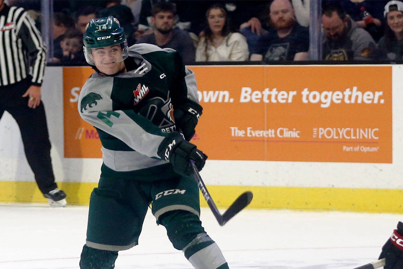 Everett Silvertips’ Austin Roest wrists a shot to the goal during the season opener against the Vancouver Giants on Saturday, Sep. 24, 2022, at Angel of the Winds Arena in Everett, Washington. (Ryan Berry / The Herald)