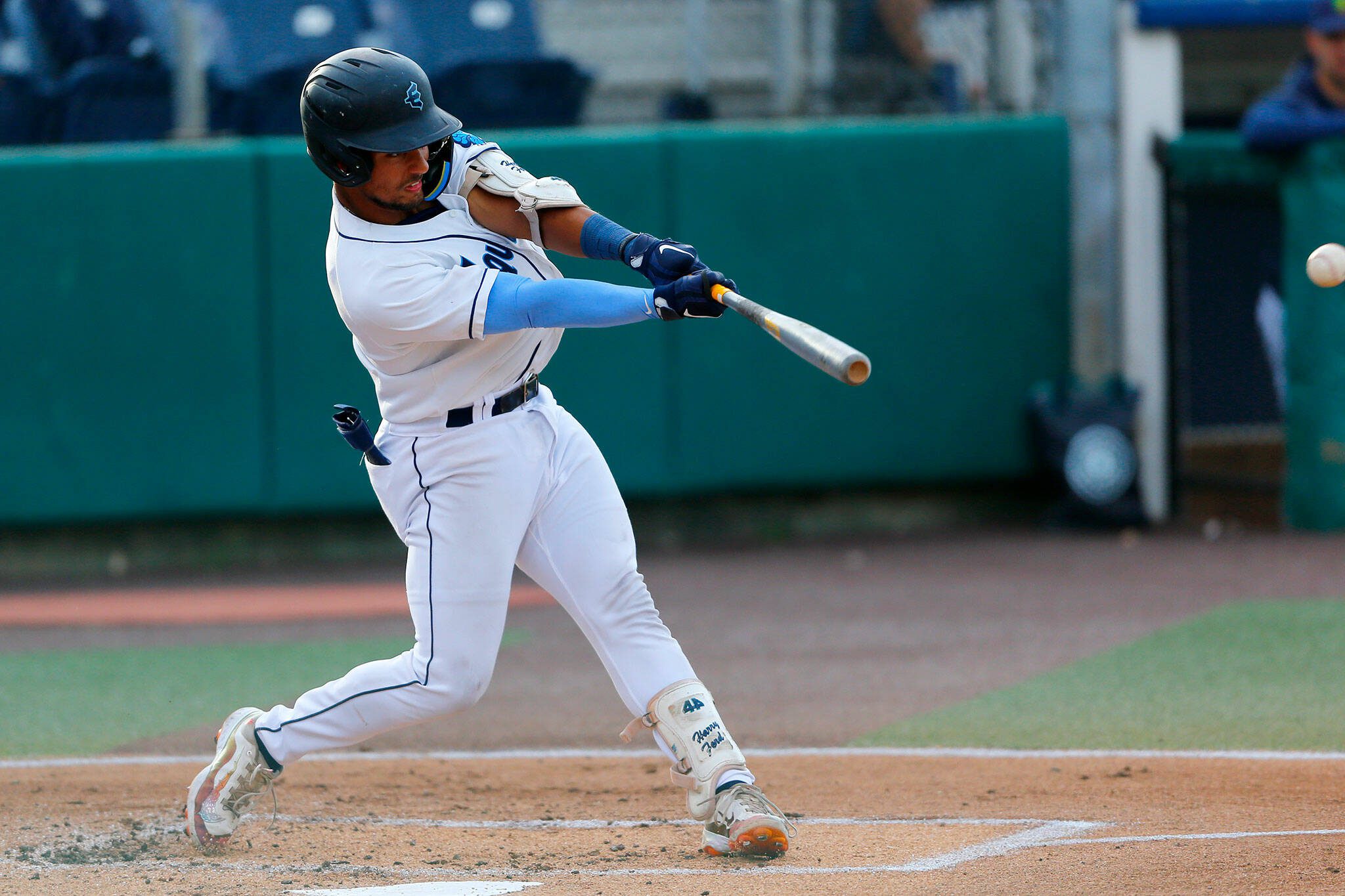 AquaSox catcher Harry Ford hits a fly ball during a game against the Vancouver Canadians on June 8 at Funko Field in Everett. (Ryan Berry / The Herald)