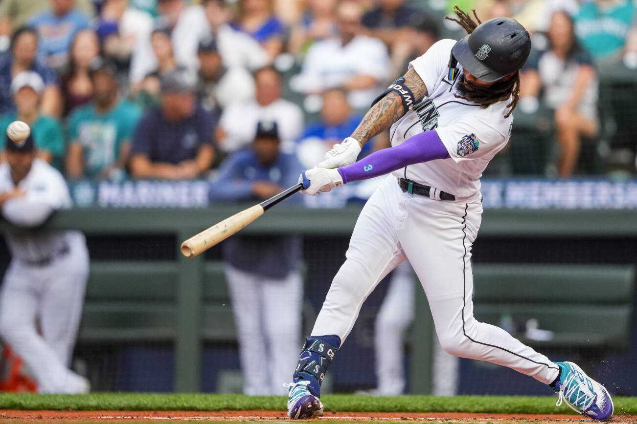 Seattle Mariners' J.P. Crawford hits a solo home run against Washington Nationals starting pitcher Trevor Williams during the first inning of a baseball game Monday, June 26, 2023, in Seattle. (AP Photo/Lindsey Wasson)