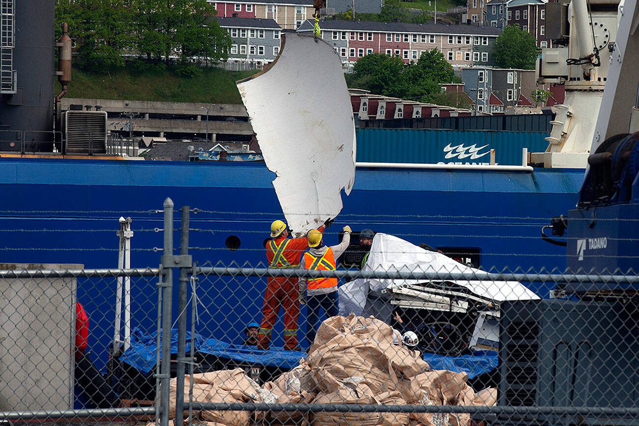 Debris from the Titan submersible, recovered from the ocean floor near the wreck of the Titanic, is unloaded from the ship Horizon Arctic at the Canadian Coast Guard pier in St. John's, Newfoundland, Wednesday, June 28, 2023. (Paul Daly/The Canadian Press via AP)