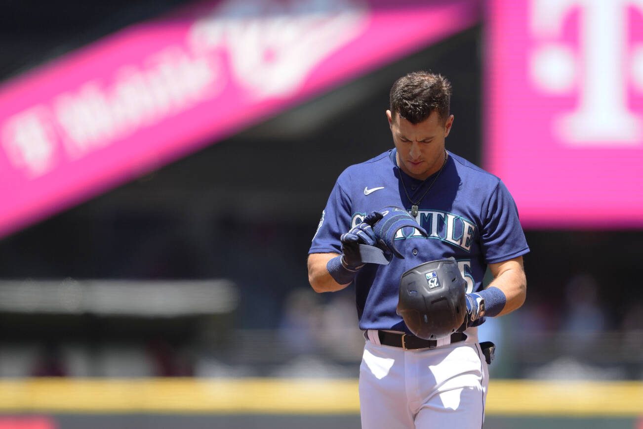 Seattle Mariners' Dylan Moore stands on the field after popping out with runners on base to end the second inning against the Washington Nationals during a baseball game Wednesday, June 28, 2023, in Seattle. (AP Photo/Lindsey Wasson)
