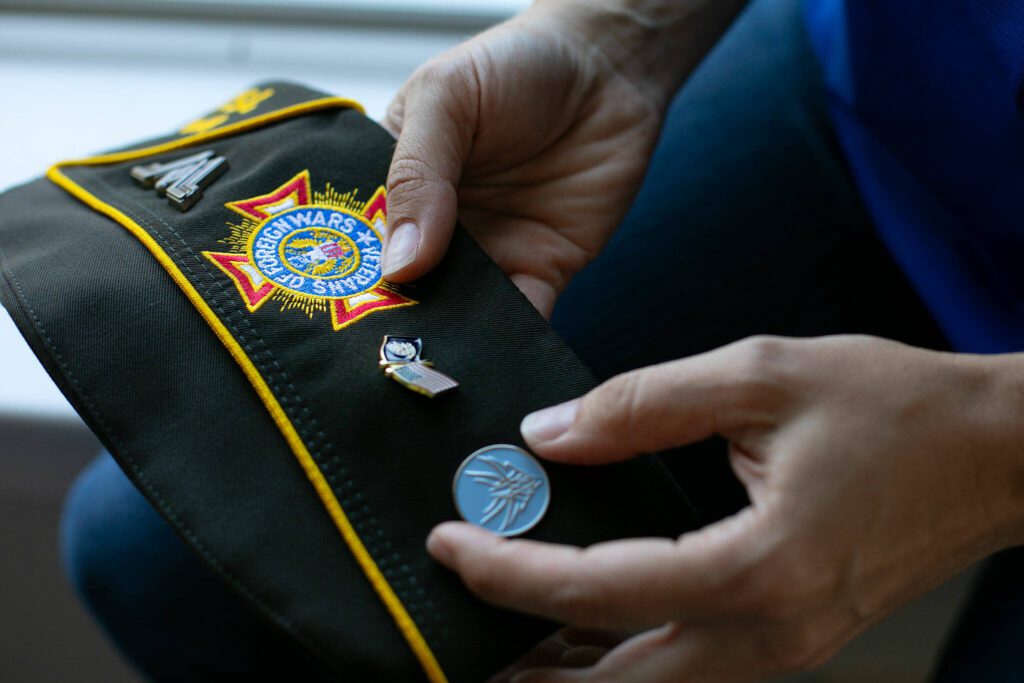 VFW Post 7511 Commander Casi Myers holds her VFW cap on June 23, 2023, in Monroe, Washington. Having just been promoted to post commander, Myers is still waiting on her new cap. (Ryan Berry / The Herald)
