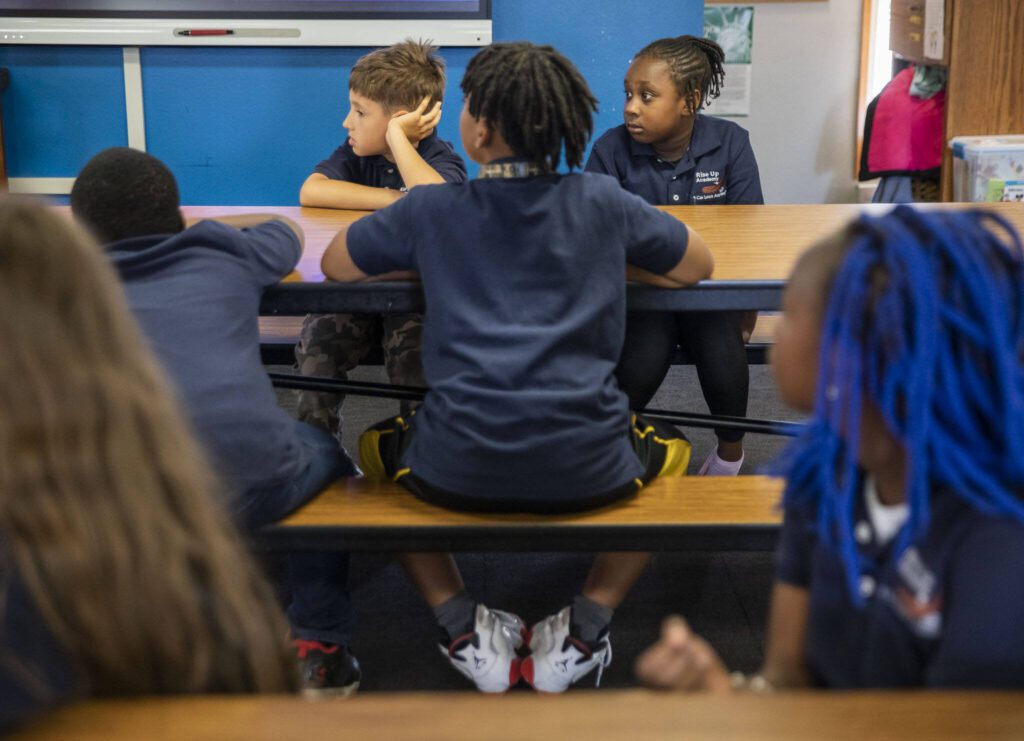 Rise Up Academy students listen while their teachers give them activity instructions on Thursday, July 6, 2023 in Everett, Washington. (Olivia Vanni / The Herald)
