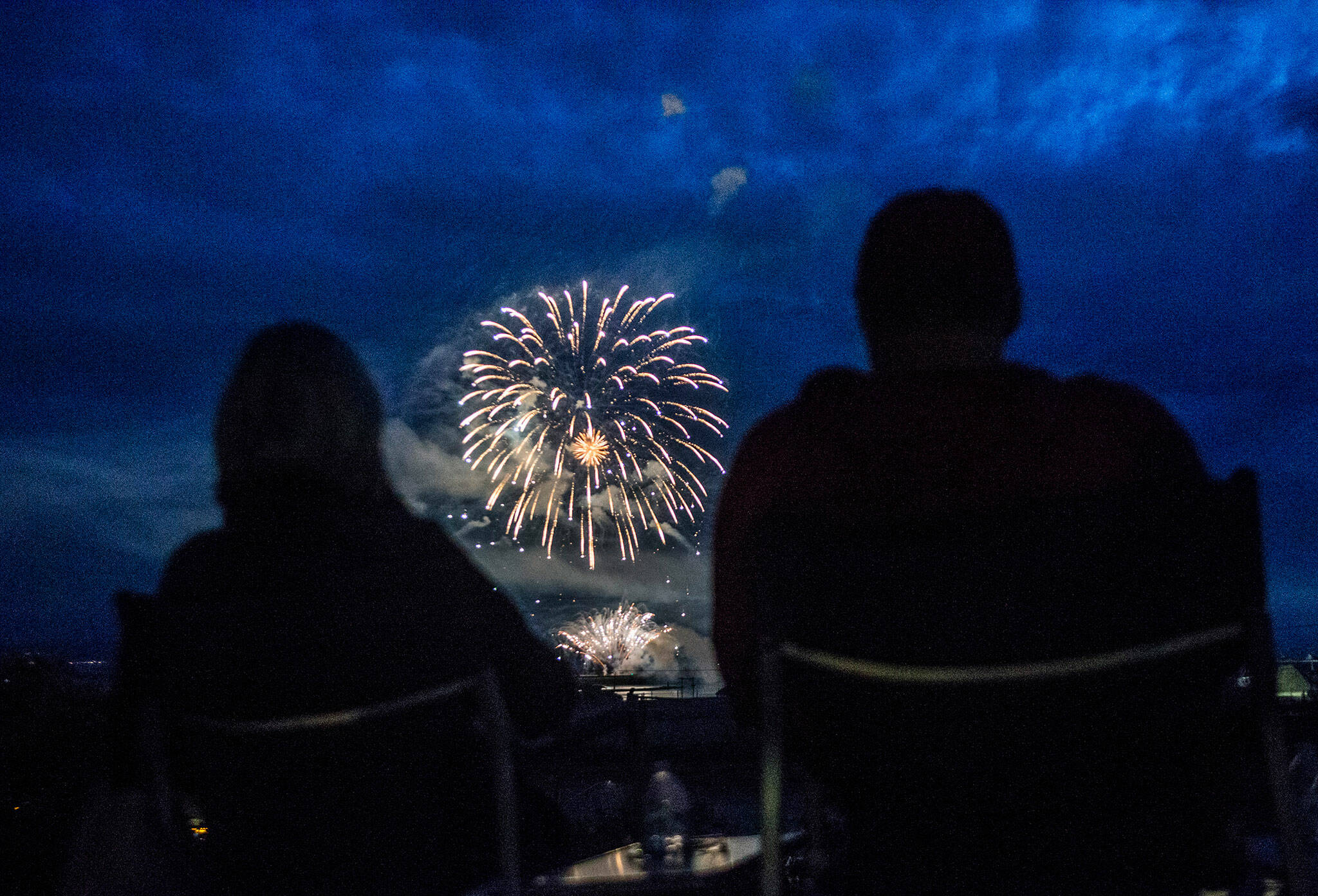 People watch Thunder on the Bay Fireworks from Legion Memorial Park on Wednesday, July 4, 2018 in Everett, Wa. (Olivia Vanni / The Herald)