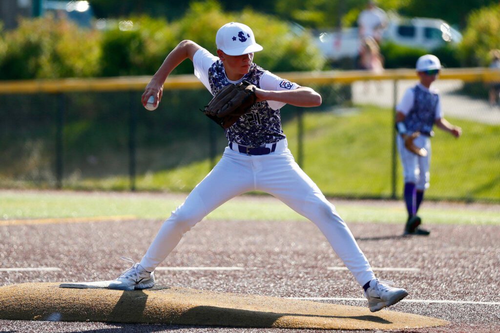 Lake Stevens All Star Joel Dellino deals a pitch against Everett during a 12u Little League matchup on Wednesday, July 5, 2023, at the Phil Johnson Ballfields in Everett, Washington. (Ryan Berry / The Herald)
