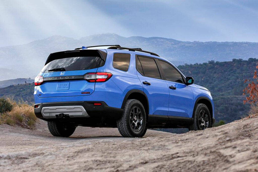 The 2023 Honda Pilot TrailSport has a Trail driving mode, hill descent control, steel skid plates, and 8.3 inches of ground clearance. (Honda) 
