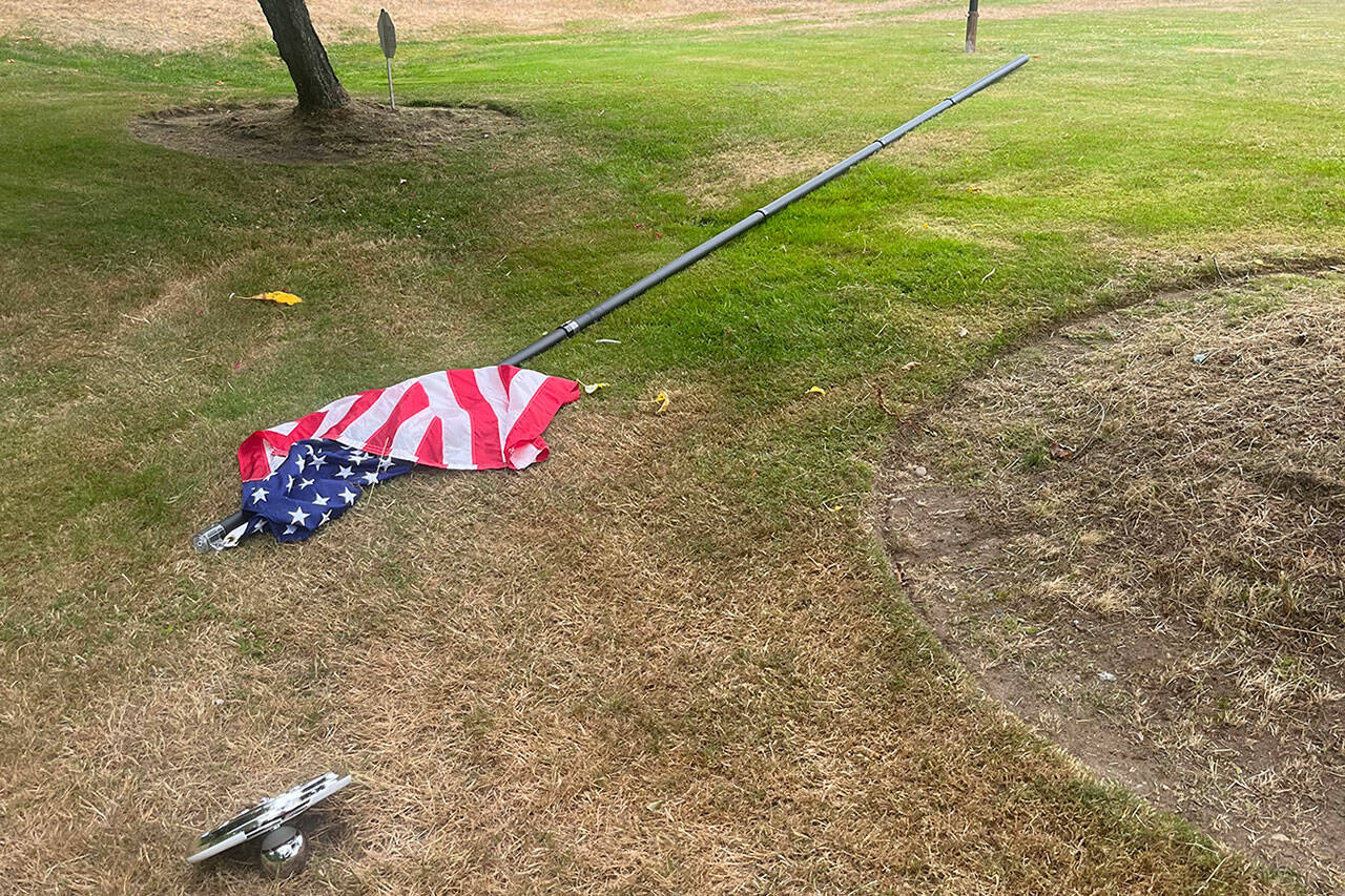 The tenth Pride flag in two years was stolen overnight Sunday in front of the Everett home of Doug Blay and Tim Pfahl. The American flag it shared the pole with was left on the ground. (Photo provided)