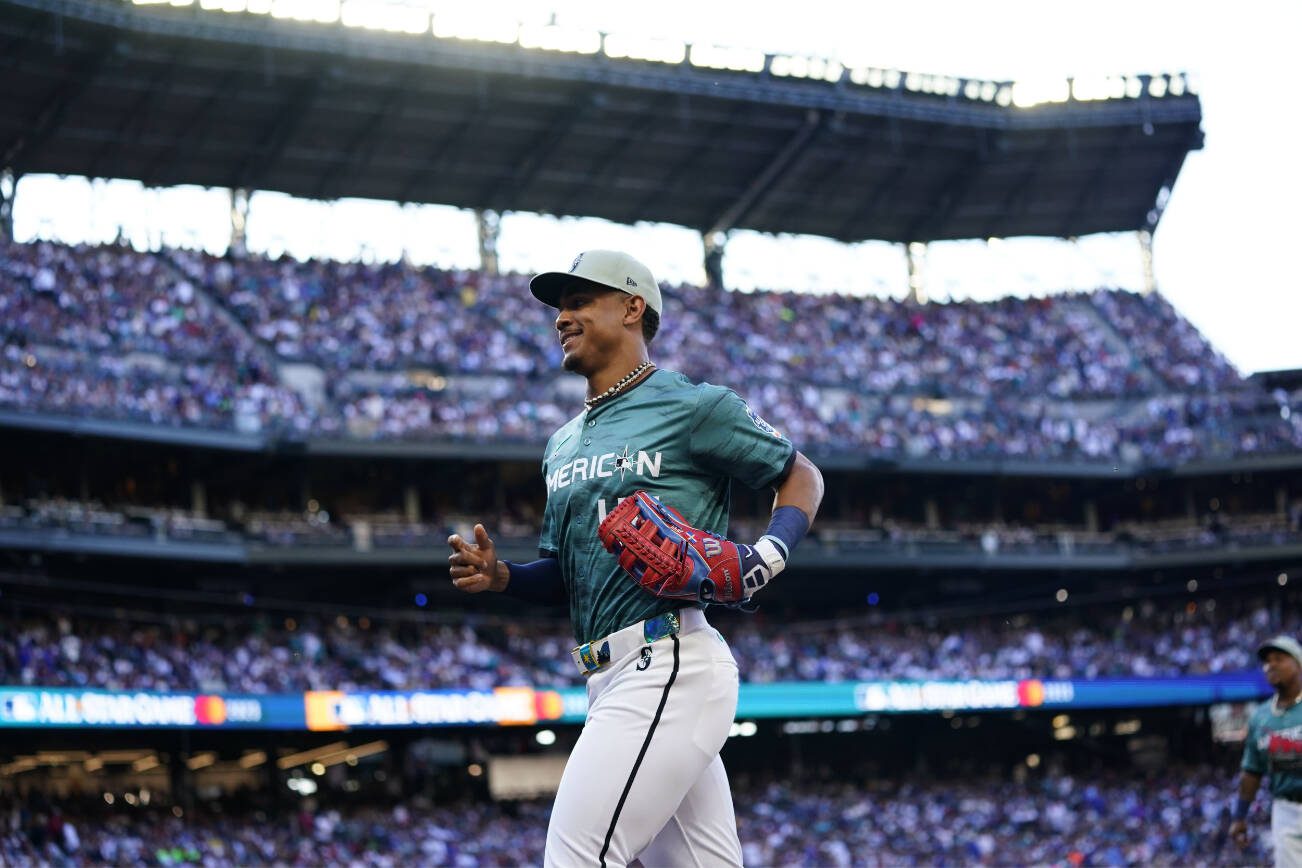 American League's Julio Rodríguez, of the Seattle Mariners, runs to the dugout in the seventh inning of the MLB All-Star baseball game in Seattle, Tuesday, July 11, 2023. The National League defeated the American League 3-2. (AP Photo/Lindsey Wasson)
