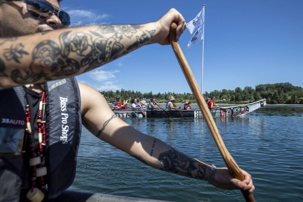 Austin Didrickson, 23, of the Tlingit tribe, paddles during the 2023 Washington Tribes Canoe Journey in Bellingham, Washington on Sunday, July 23, 2023. (Annie Barker / The Herald)
