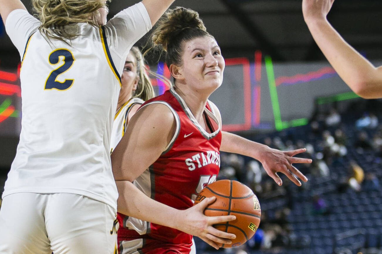 Stanwood’s Vivienne Berrett drives to the hoop during the 3A quarterfinal game against Mead on Thursday, March 2, 2023 in Tacoma, Washington. (Olivia Vanni / The Herald)