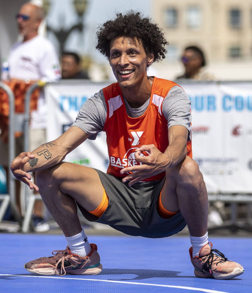 Daniels’ Broilers player Spencer Hauser celebrates during the men’s Elite Division championship game during the Everett 3on3 tournament Sunday in downtown Everett. Daniels’ Broilers won against B’s Bakery, 20-14. (Annie Barker / The Herald)
