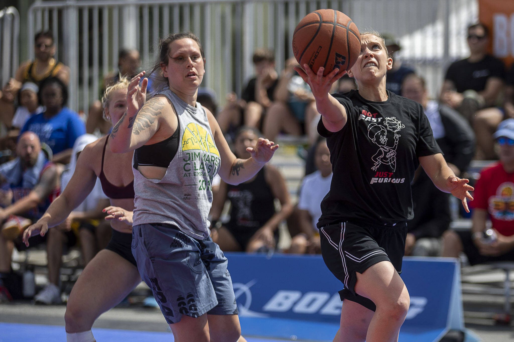 Downtown and NotFast JustFurious players face off during the women’s Elite Division championship during the Everett 3on3 tournament Sunday in downtown Everett. NotFast JustFurious won, 20-17. (Annie Barker / The Herald)