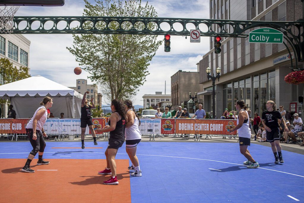 Two Elite Division women’s teams face off during the Everett 3on3 tournament Sunday in downtown Everett. (Annie Barker / The Herald)
