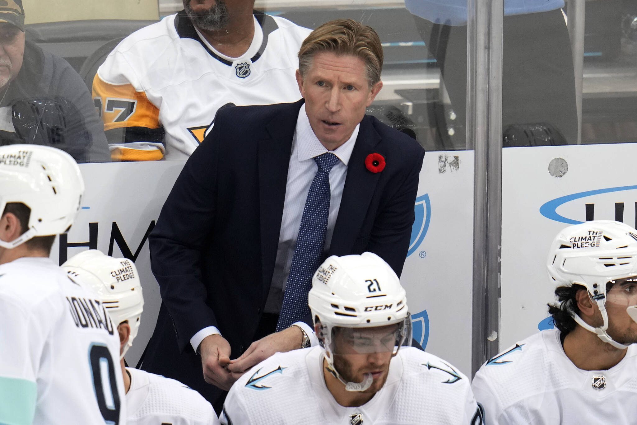 Seattle Kraken head coach Dave Hakstol stands behind his bench during the third period of a game against the Pittsburgh Penguins on Nov. 5, 2022, in Pittsburgh. (AP Photo/Gene J. Puskar)