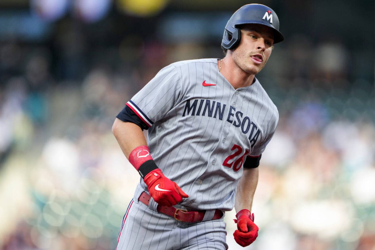 Minnesota Twins' Max Kepler runs the bases after hitting a solo home run against the Seattle Mariners during the fifth inning of a baseball game Wednesday, July 19, 2023, in Seattle. (AP Photo/Lindsey Wasson)