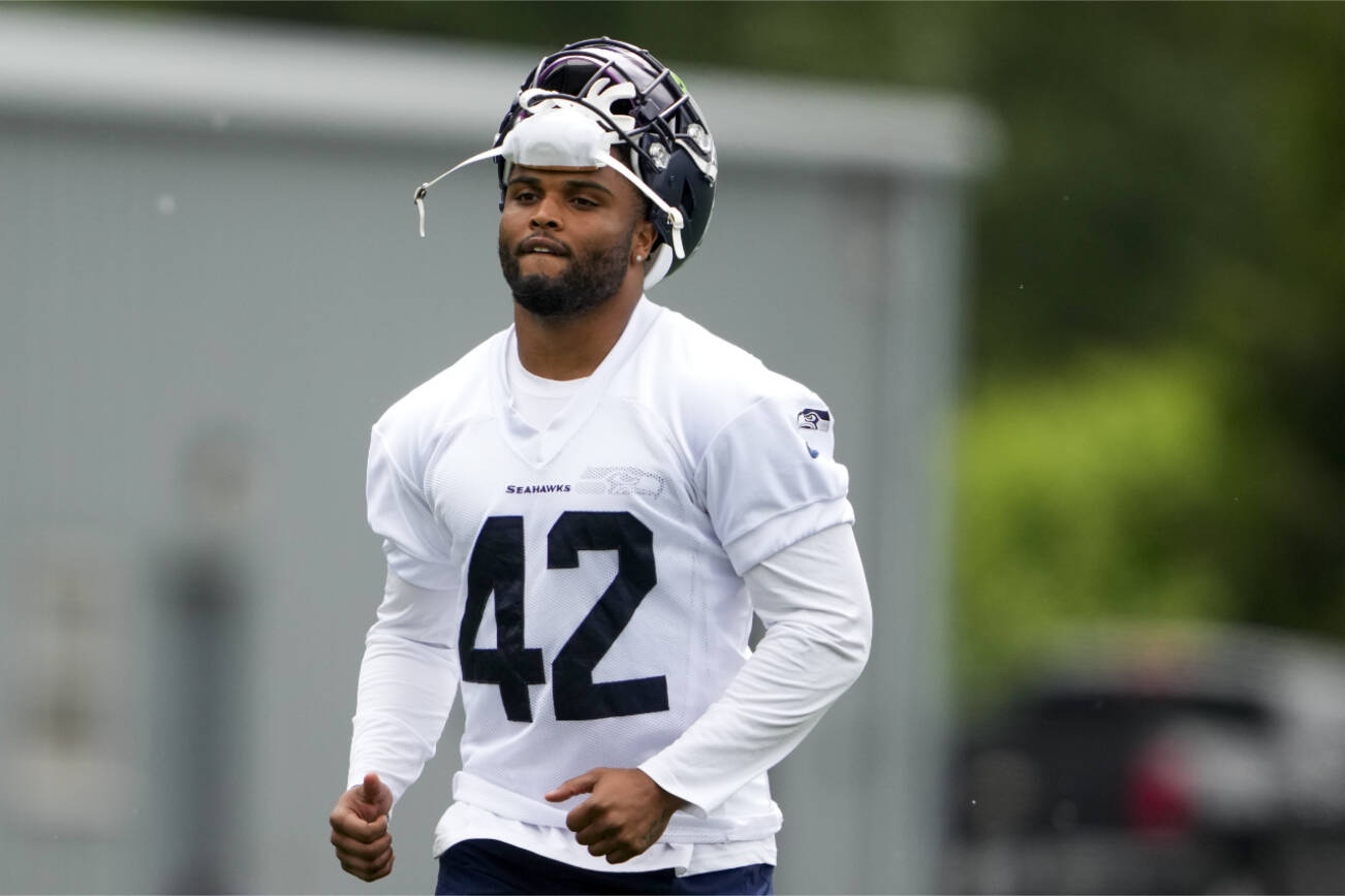 Seattle Seahawks linebacker Cam Bright (42) jogs off the field after participating in team activities Monday, May 22, 2023, at the team's NFL football training facility in Renton, Wash. (AP Photo/Lindsey Wasson)