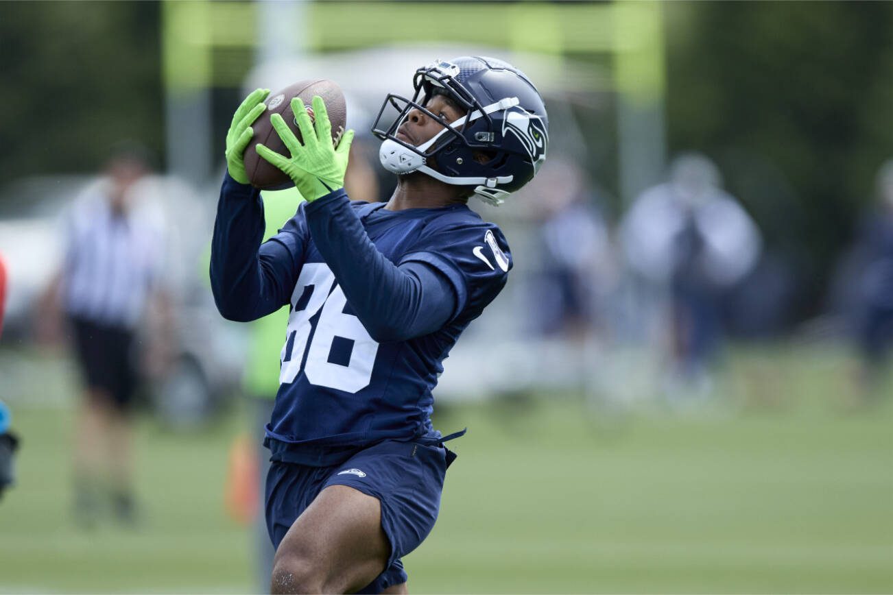 Seattle Seahawks wide receiver Easop Winston Jr. reaches for a pass during an NFL football practice, Wednesday, June 7, 2023, team's facilities in Renton, Wash. (AP Photo/John Froschauer)