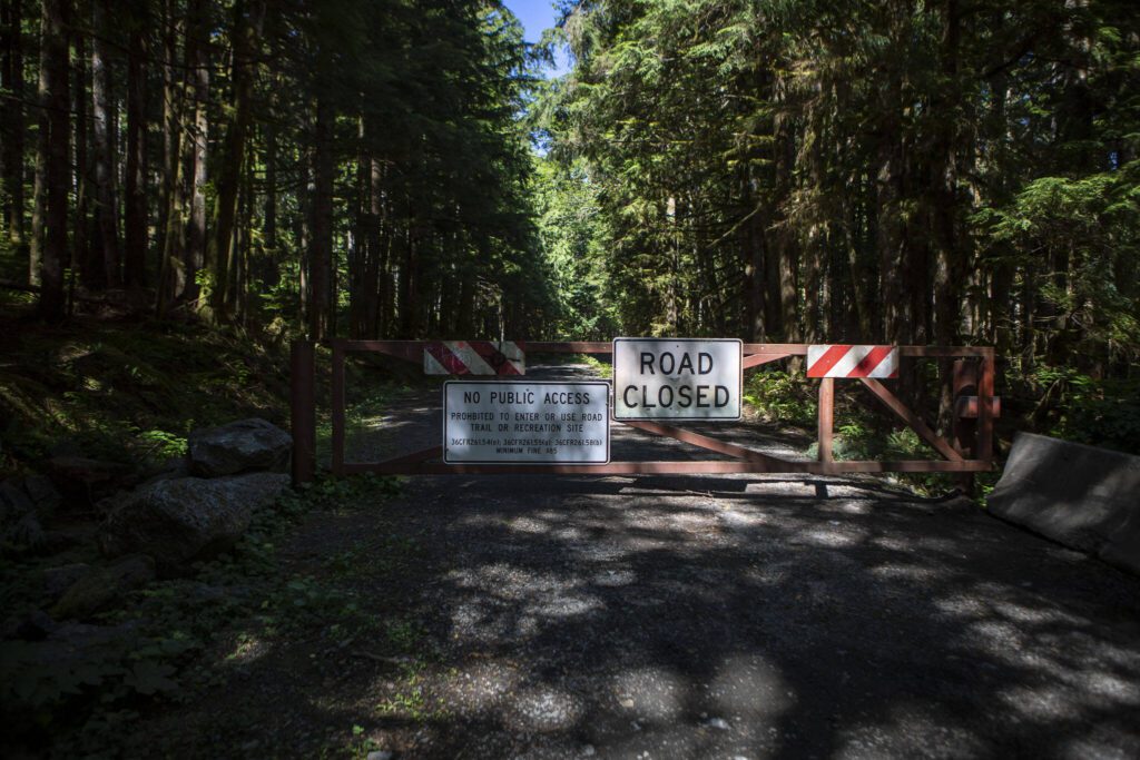 A closed road at the Heather Lake Trail parking lot along the Mountain Loop Highway in Snohomish County, Washington on Wednesday, July 19, 2023. (Annie Barker / The Herald)
