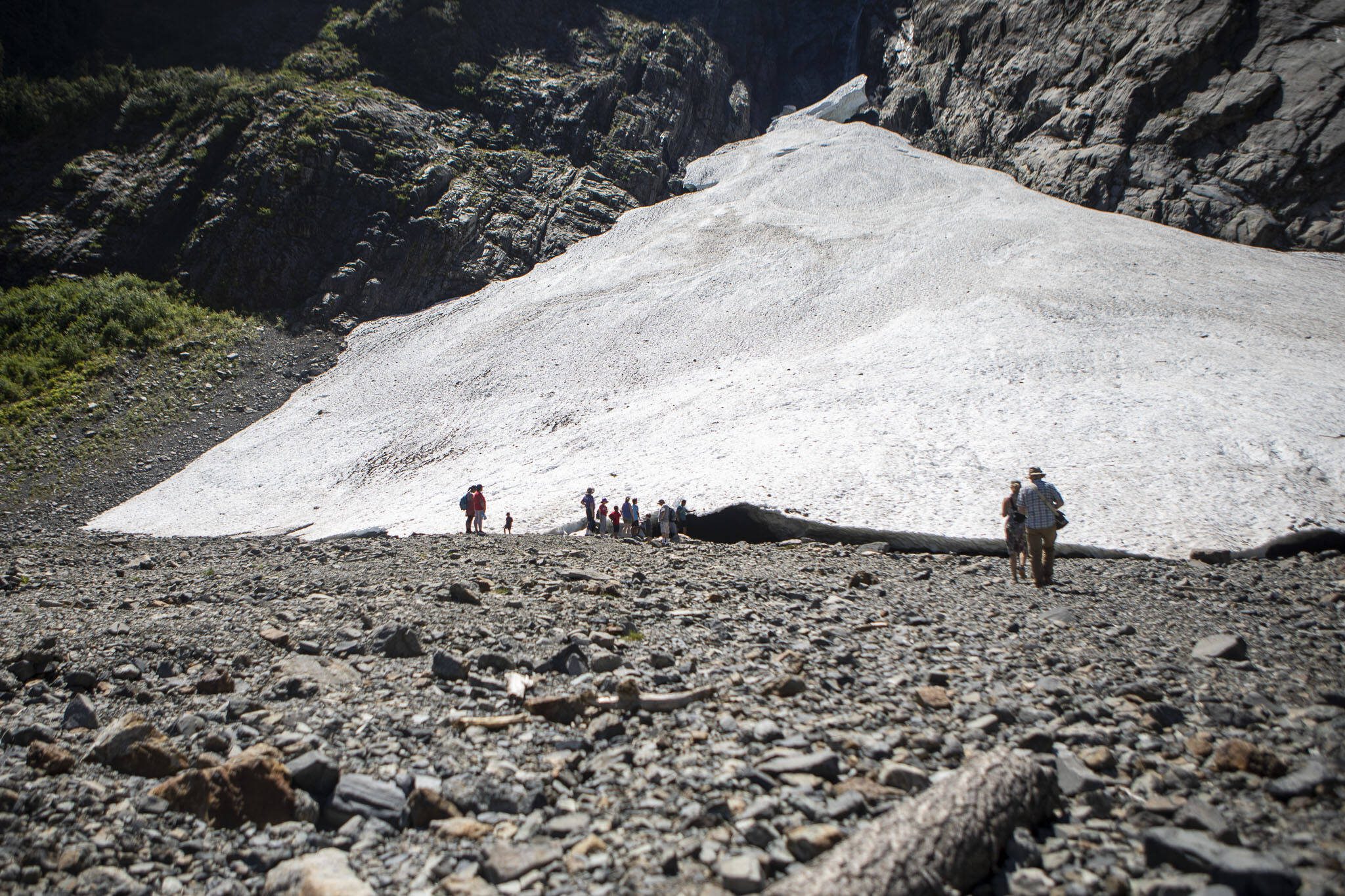 People explore at the Big Four Ice Caves along the Mountain Loop Highway in Snohomish County, Washington on Wednesday, July 19, 2023. (Annie Barker / The Herald)