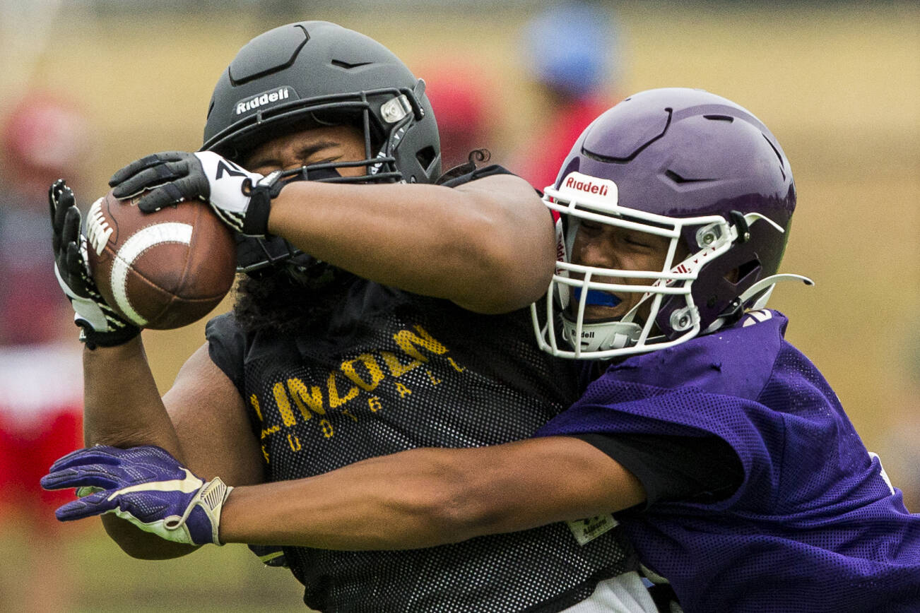 Lake Stevens' Joey Dosen tries to block a pass during the Cougars Championship Passing Tournament at Lakewood High School on Saturday, July 31, 2021 in Arlington, Wash. (Olivia Vanni / The Herald)