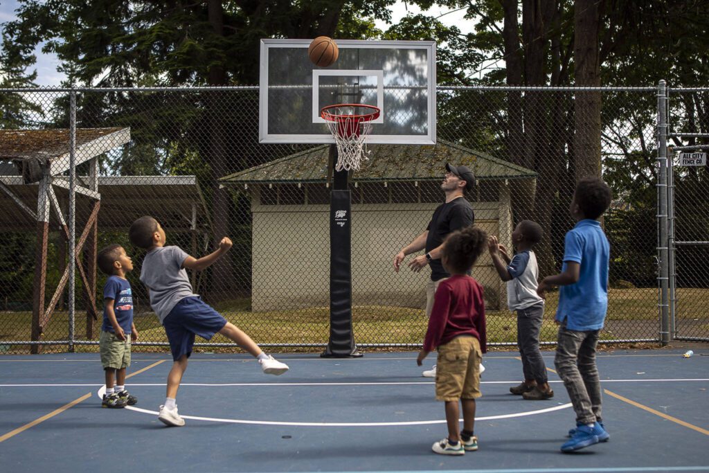 People play basketball during the Nubian Jam at Forest Park in Everett, Washington on Saturday, July 29, 2023. (Annie Barker / The Herald)
