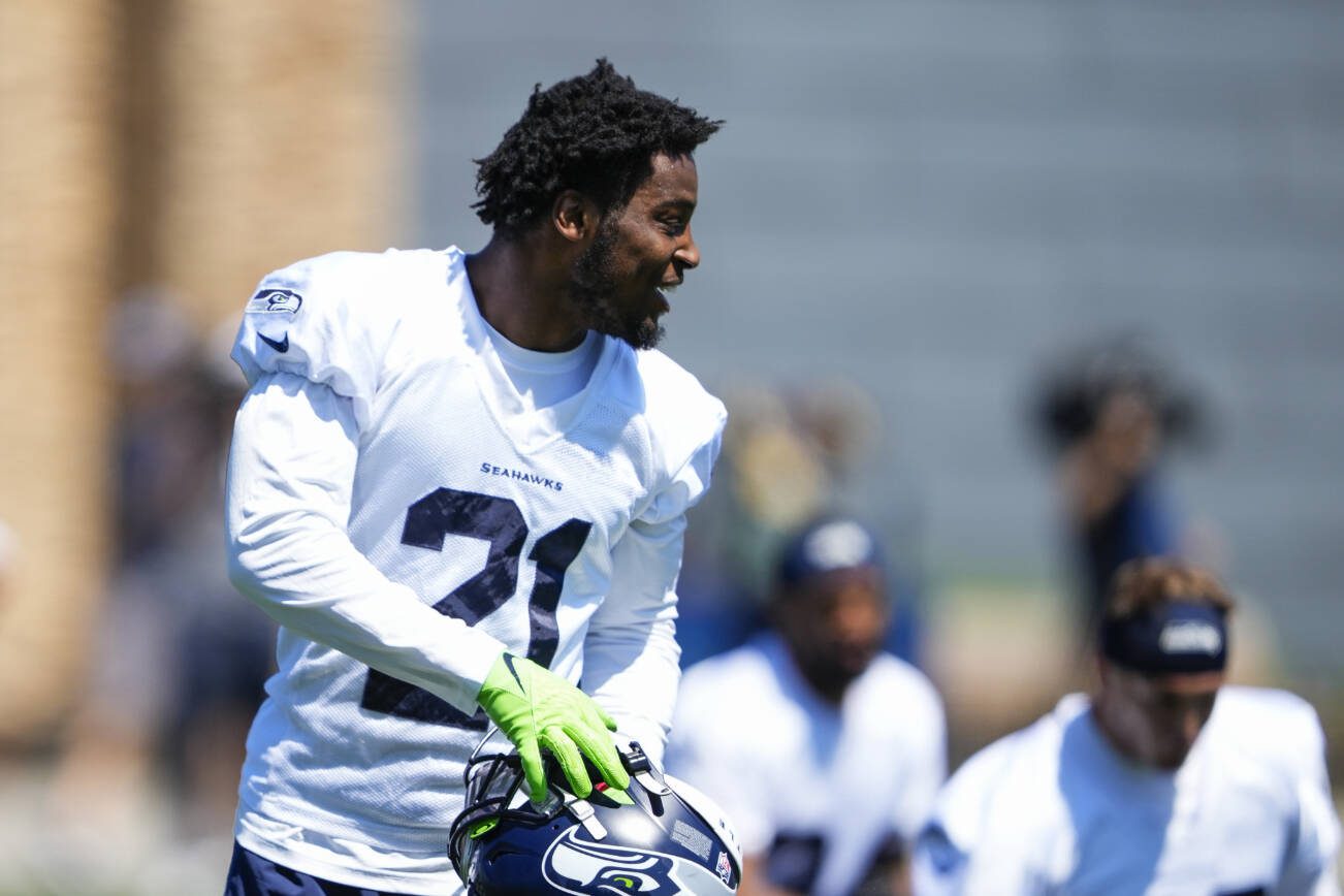 Seattle Seahawks cornerback Devon Witherspoon (21) smiles while running drills during minicamp Tuesday, June 6, 2023, at the NFL football team's facilities in Renton, Wash. (AP Photo/Lindsey Wasson)