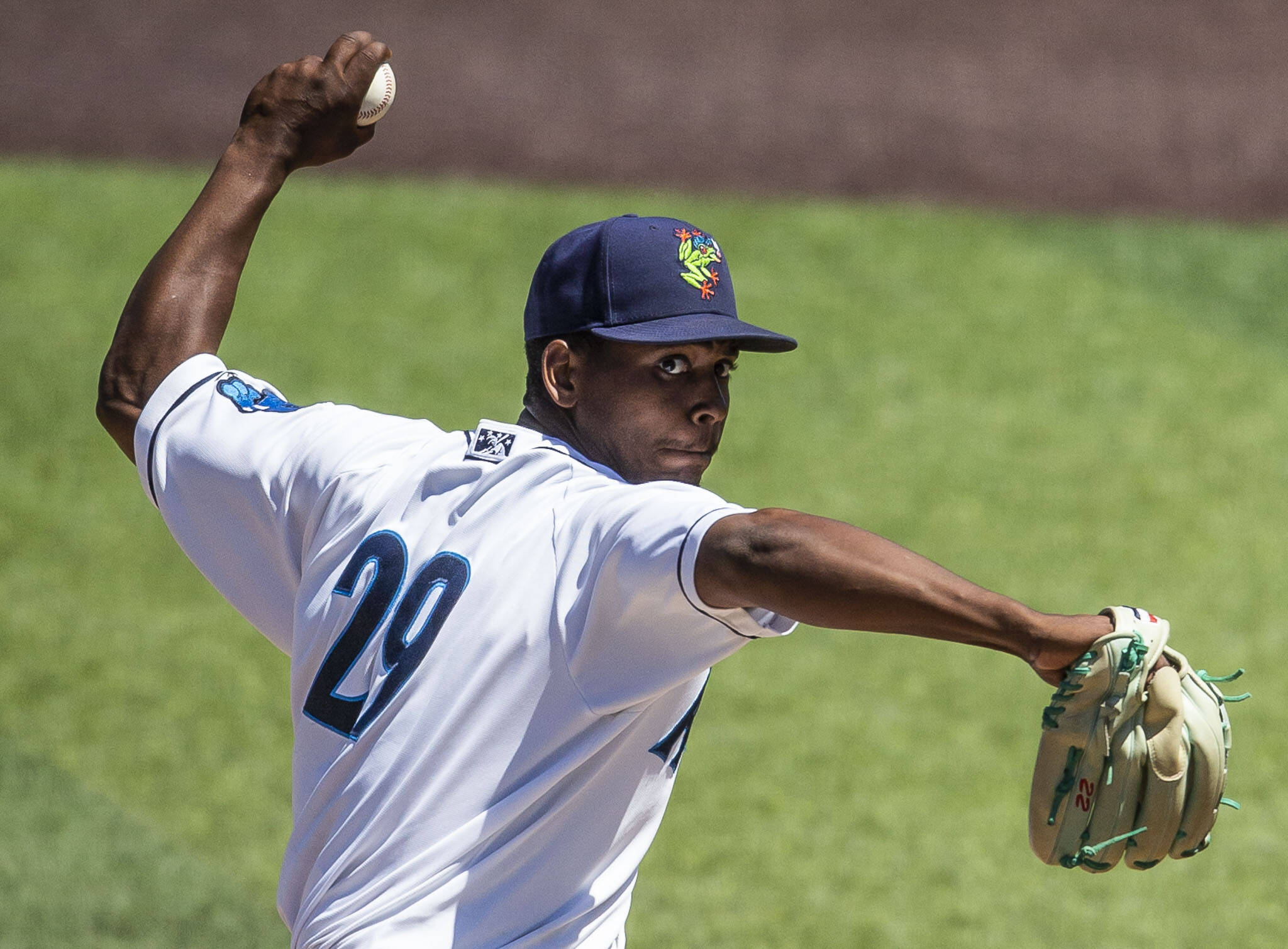 The AquaSox’s Raul Alcantara winds up to pitch during a game against the Dust Devils on July 19 at Funko Field in Everett. (Olivia Vanni / The Herald)