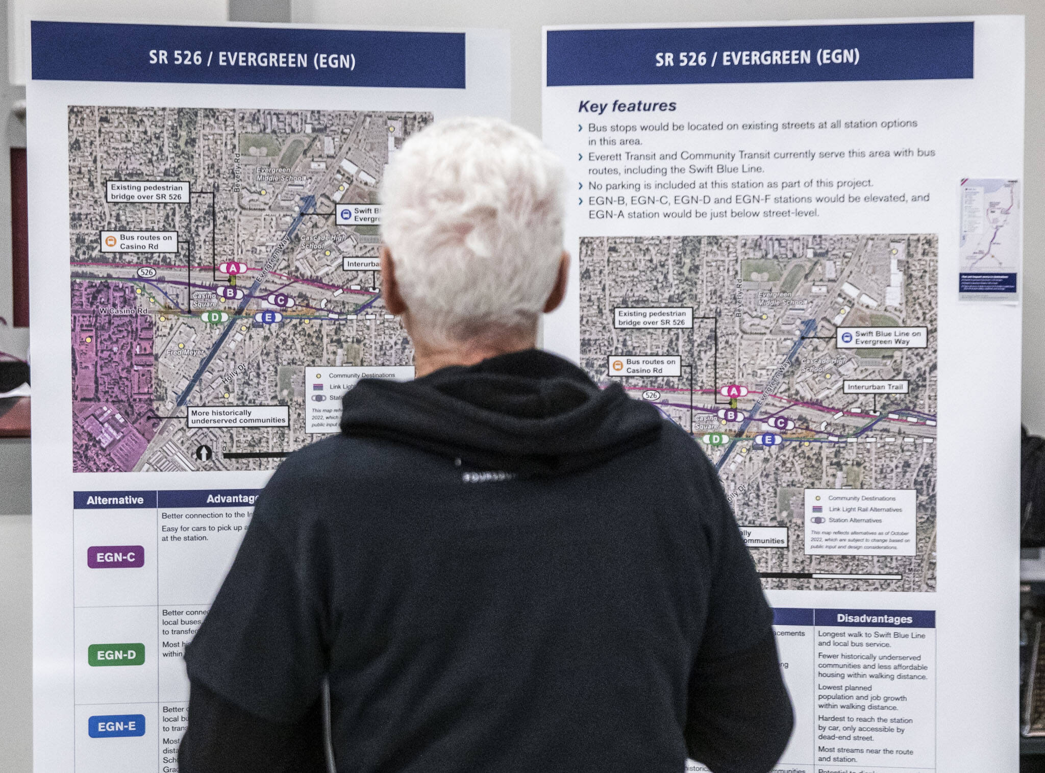 A man stops to look through the proposed Link light rail station for SR 526 and Evergreen Way on Wednesday, Feb. 15, 2023 in Everett, Washington. (Olivia Vanni / The Herald)