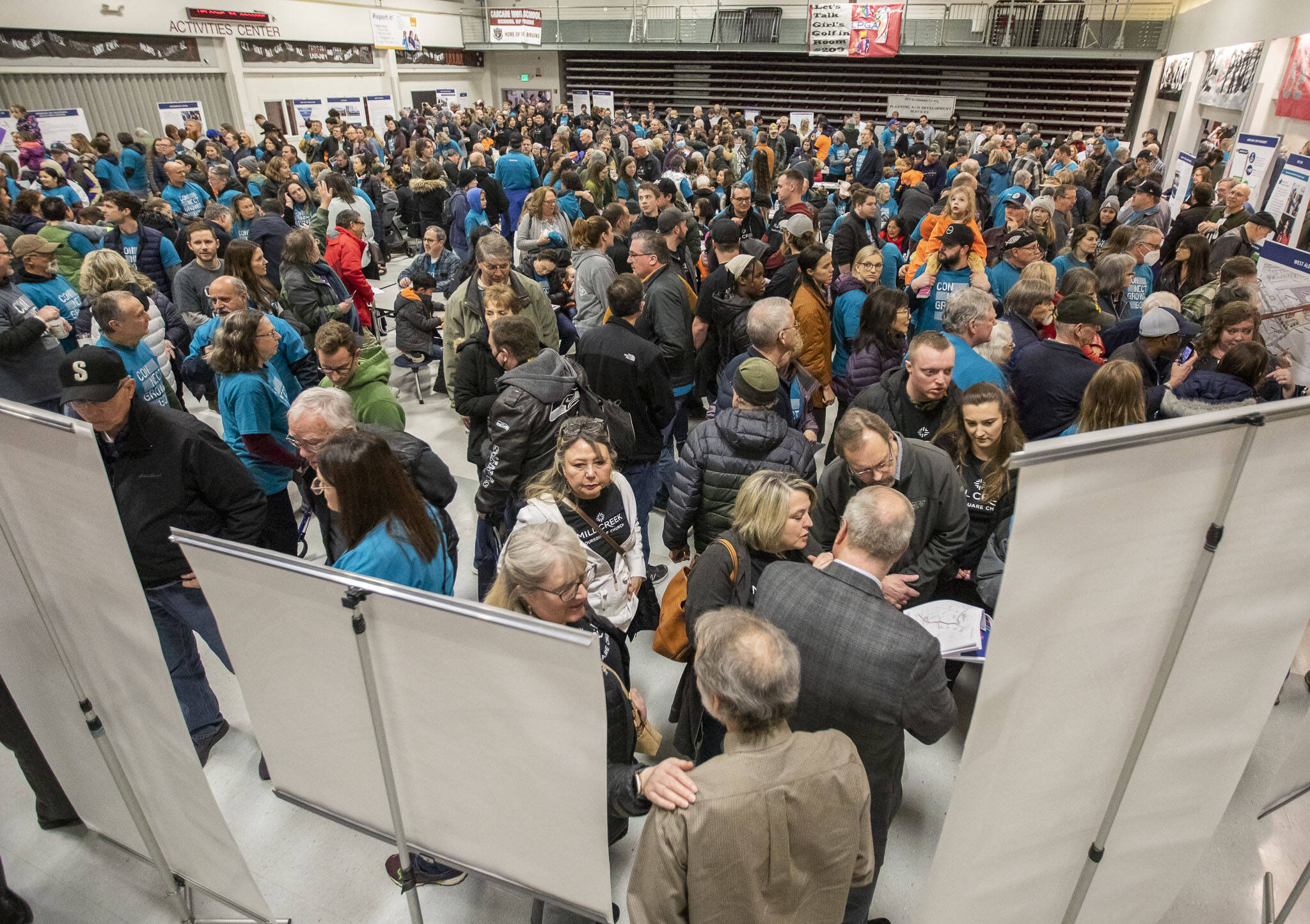 Hundreds of Alderwood Community Church and Mill Creek Foursquare Church leaders and members fill Cascade High School’s lunchroom during Sound Transit’s in-person open house on Wednesday, Feb. 15, 2023 in Everett, Washington. (Olivia Vanni / The Herald)