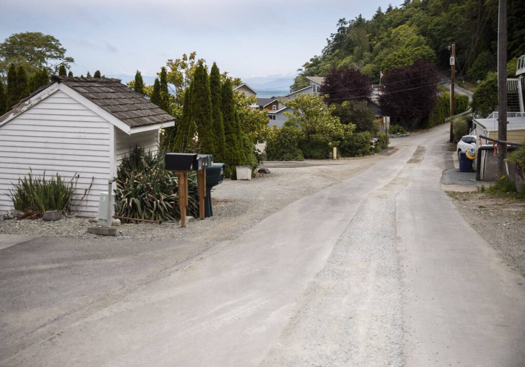 Gravel is visible where new pipe has been installed along Maple Grove Road on Wednesday, June 28, 2023 in Camano Island, Washington. (Olivia Vanni / The Herald)
