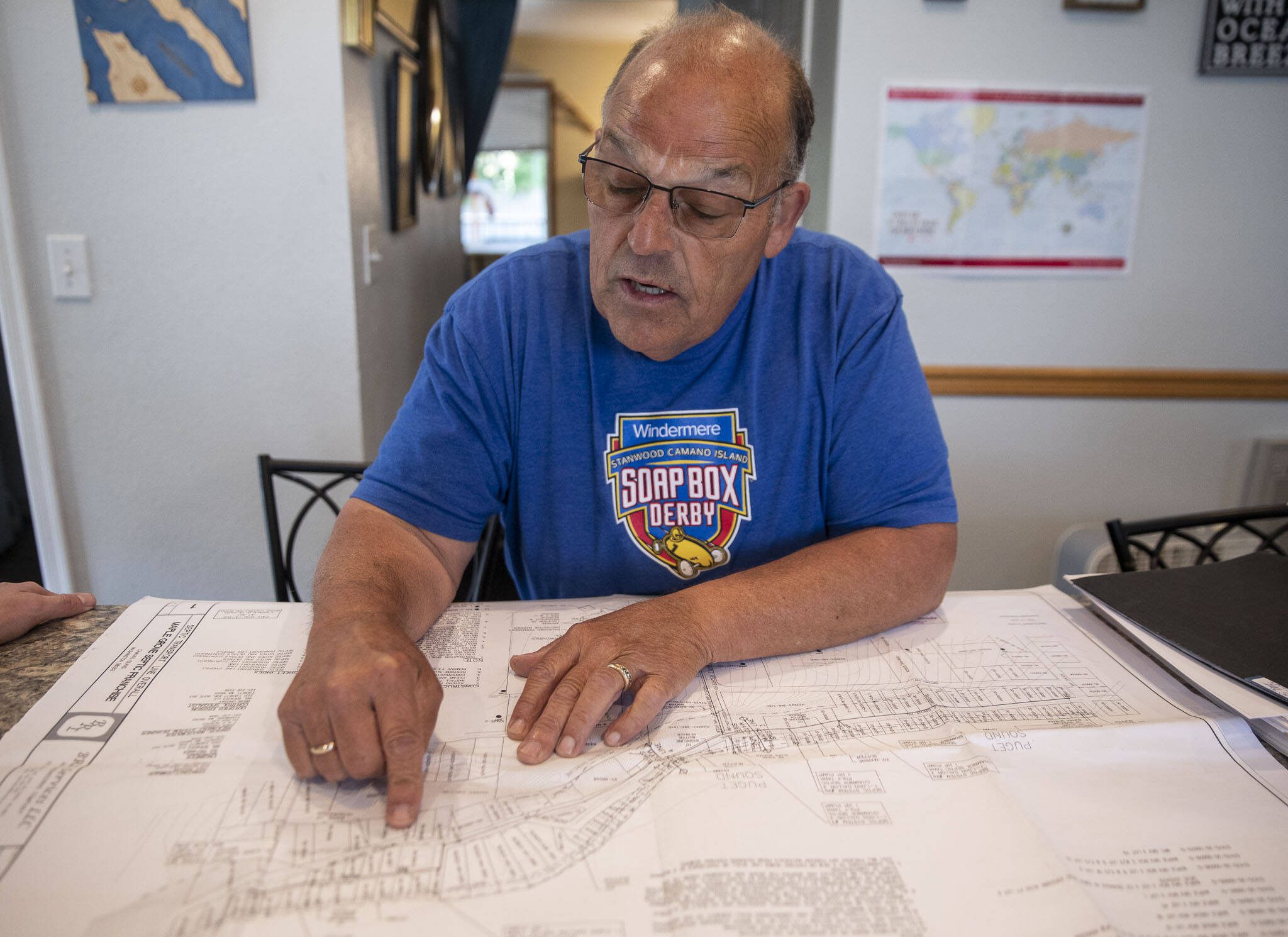 Paul Rochon walks through details of Maple Grove septic project on Wednesday, June 28, 2023 in Camano Island, Washington. (Olivia Vanni / The Herald)