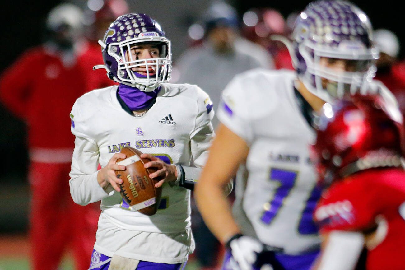 Lake Stevens quarterback Kolton Matson drops back to pass against Kennedy Catholic in the WIAA 4A State Football Championship game Saturday, Dec. 3, 2022, at Mount Tahoma Stadium in Tacoma, Washington. (Ryan Berry / The Herald)